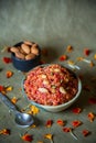 Gajar ka halwa is a carrot-based sweet dessert pudding from India. Garnished with Cashew and Almond nuts, served along with a bowl Royalty Free Stock Photo