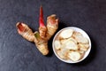 Galangal and chopped galangal in the small bowl