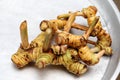 Galangal root on metal tray Royalty Free Stock Photo