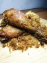 Galangal spiced fried chicken on a wooden cutting board