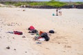 GALAPAGOS, ECUADOR- NOVEMBER, 11 2018: Outdoor view of clothes of turists laying in the yellow sand located on Bartolome Royalty Free Stock Photo