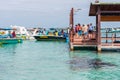 GALAPAGOS ISLAND, ISLA ISABELA - JULY 2, 2019: Group of tourists on the pier