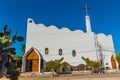 GALAPAGOS ISLAND, ISLA ISABELA - JULY 2, 2019: View of the facade of the church against the blue sky