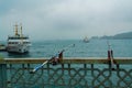 Fishing rods on Galata Bridge Istanbul rainy day view Istanbul Turkey Royalty Free Stock Photo