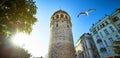 Galata Kulesi Tower and street in the old city of Istanbul, Turkey. Ancient Turkish famous landmark in Beyoglu district, European Royalty Free Stock Photo