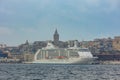 Galata Tower and a cruise ship docked at the Galataport. Visit Istanbul concept
