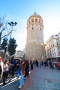 Galata Tower and people or tourists in wide angle vertical view