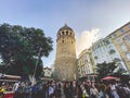 Galata Tower and the street in the Old Town of Istanbul, Turkey October 27, 2019. BELTUR Galata Kulesi or Galata tower in the old Royalty Free Stock Photo