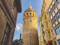 Galata Tower and the street in the Old Town of Istanbul, Turkey October 27, 2019. BELTUR Galata Kulesi or Galata tower in the old Royalty Free Stock Photo