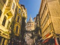 Galata Tower and the street in the Old Town of Istanbul, Turkey October 27, 2019. BELTUR Galata Kulesi or Galata tower in the old Royalty Free Stock Photo