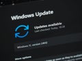 Galati, Romania - December 13, 2024: Checking for 24H2 Windows 11 updates on laptop screen close up view, focus on 24H2 Royalty Free Stock Photo