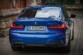 Galati, Romania - July 4, 2020: 2020 Blue BMW 3 Series G20 M340i xDrive Steptronic rear view on a street among old buildings Royalty Free Stock Photo