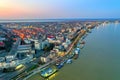 Galati, ROMANIA - March 19, 2021: Aerial view of Galati City, Romania. Danube River near city with sunset warm light