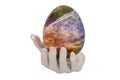 Galaxy Easter egg with hand isolated on white background. 3D illustration Royalty Free Stock Photo