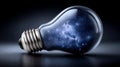 A galaxy inside a lightbulb on a dark background. Royalty Free Stock Photo