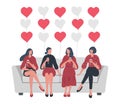 Galentines day. Slumber party. Four young women are sitting on the sofa and drinking wine