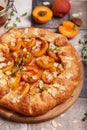 Galette with apricots, brown sugar, honey, and almond petals