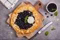 Galette with blueberries, almond petals and vanilla ice cream scoop Royalty Free Stock Photo
