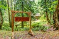 Galiano Island, BC - August 24, 2019: Exterior signage of Pilgrim Restaurant tucked amidst the forest of Galiano Island