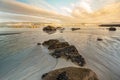 Galicia beach with rocks at sunset Royalty Free Stock Photo