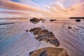 Galicia beach with rocks at sunset Royalty Free Stock Photo