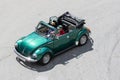 High angle view of a classic Volkswagen Beetle Cabrio car driving on a road Royalty Free Stock Photo