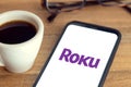 ROKU logo on Smart phone screen on table