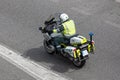 Guardia Civil motorcyclist riding down street. Traffic surveillance