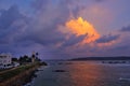 Galle lighthouse stands guard over the Indian ocean at sunset; SriLanka coast. Royalty Free Stock Photo