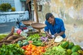 GALLE, SRI LANKA - February, 14, 2016: Street vendor with vegetables and vintage scales