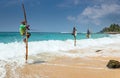 Galle, SRI LANKA. The local fishermen are fishing in unique style. Royalty Free Stock Photo