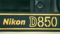 Galle, Sri Lanka - 02 17 2021: Nikon D850 DSLR and camera strap on wooden table close up, brand new Nikon logo embroidered in Royalty Free Stock Photo