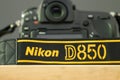 Galle, Sri Lanka - 02 17 2021: Nikon D850 DSLR and camera strap on wooden table close up, brand new Nikon logo embroidered in Royalty Free Stock Photo