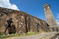 Galle, Sri Lanka - November 21, 2019: Statues of Dutch colonial soldiers and local Sinhalese workers at the Moon Bastion of Galle