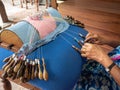 GALLE, SRI LANKA - 03/18/2019: Old Indian woman making bobbin l