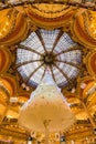 Galleries Lafayette Haussman interior with glass cupola at Christmas. Paris, France