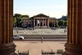 the Gallery of Art or Palace of Art. old classicist stone museum in Budapest seen between fluted stone columns