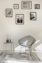 Gallery of black and white photos on empty wall of spacious living room interior Royalty Free Stock Photo