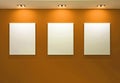 Gallery Interior with empty frames on orange wall Royalty Free Stock Photo