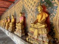 Gallery with old vessels of the seated Buddha in the Buddhist temple Wat Arun. Bangkok, Thailand Royalty Free Stock Photo