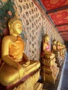 Gallery with old vessels of the seated Buddha in the Buddhist temple Wat Arun. Bangkok, Thailand Royalty Free Stock Photo