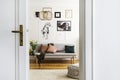 Gallery of poster on white wall of stylish living room