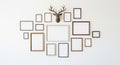 Gallery Wall Display with Assorted Empty Picture Frames and a Deer Head Mount empty frames Royalty Free Stock Photo