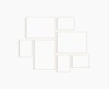 Gallery wall mockup. Set of 7 light wood frames. Gallery wall frame mockup. Royalty Free Stock Photo