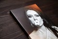 Gallery wrap, photography printed on glossy synthetic canvas and stretched on wooden stretcher bar, lateral side closeup.