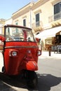 A Calessino Bee Ape Calessino, the small vehicle Piaggio, carrying tourists as it Royalty Free Stock Photo