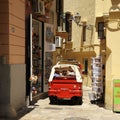 A Calessino Bee Ape Calessino, the small vehicle Piaggio, carrying tourists as it Royalty Free Stock Photo