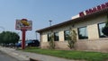 Side view of El Sombrero Restaurant with a roadside billboard in Gallup, New Mexico