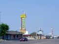 Street view with roadside signs in front of of motels in Gallup