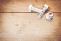 galvanized bolts on a wood background